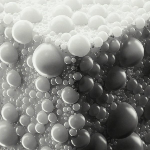 Abstract pattern of many small and large spheres.