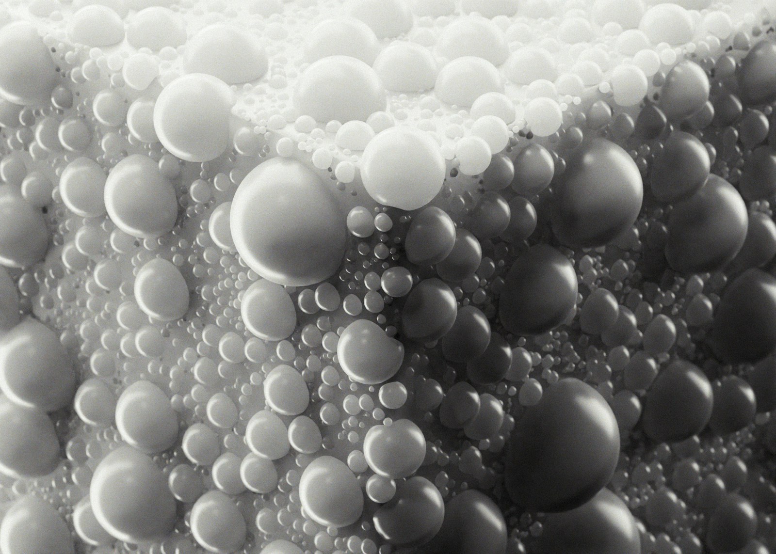 Abstract pattern of many small and large spheres.